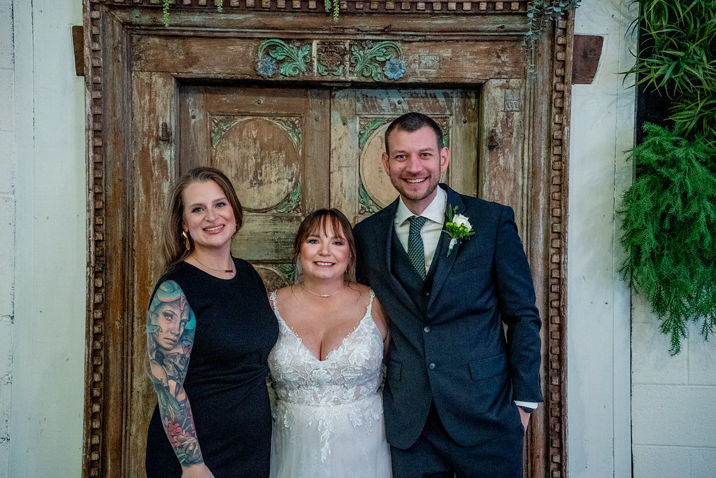 Newly Wed Couple pictured with officiant in Louisville Kentucky